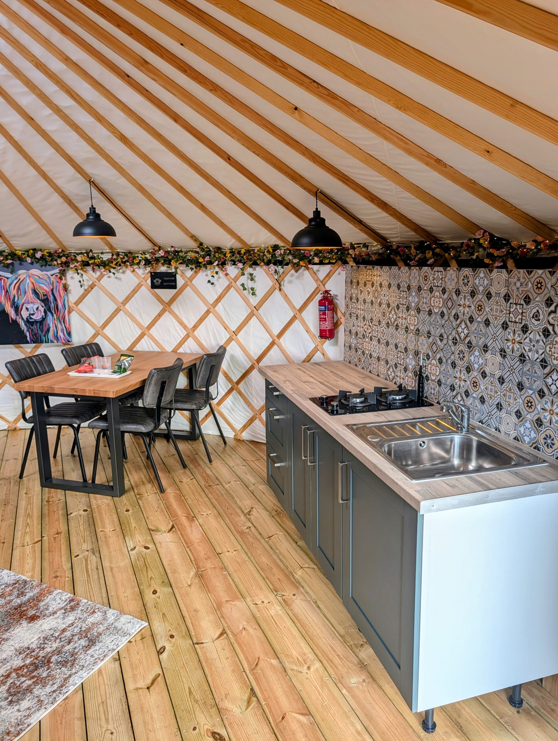 XL yurts have a larger kitchen and dinning area.