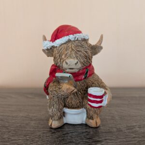 Xmas Highland Cow on the toilet